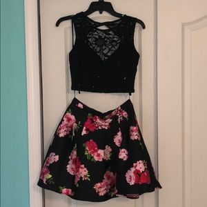 Black top and red/pink flower skirt matching set